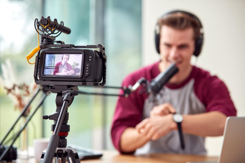 Male Vlogger Recording Wristwatch Product Review Video At Home With Camera - Embracing the 'Evergreen Content' Strategy: How Timeless Articles Boost Traffic Year-Round - Embracing an evergreen content strategy can help small business owners break out of the exhausting trend-chasing content cycle. Learn how to create high-value articles with longevity. - your wp guy